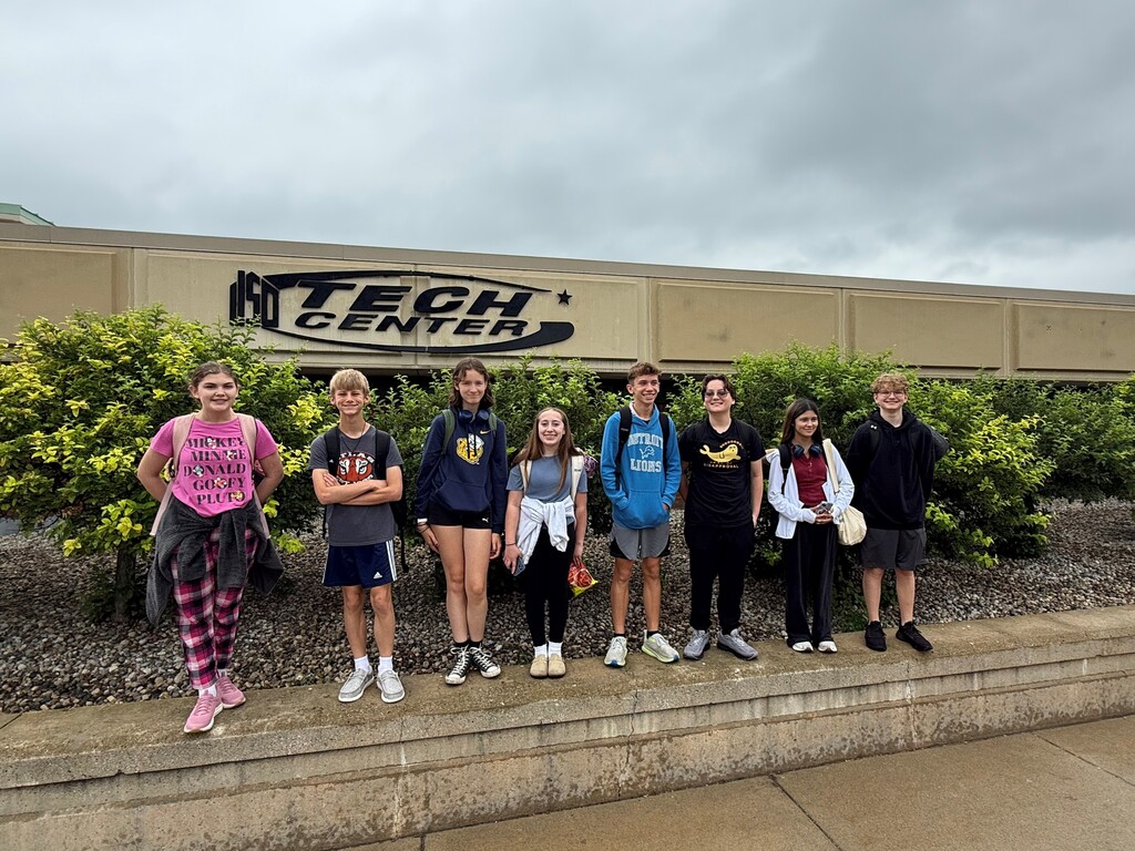 A photo of the 8 students heading to Japan posing in front of the TECH Center