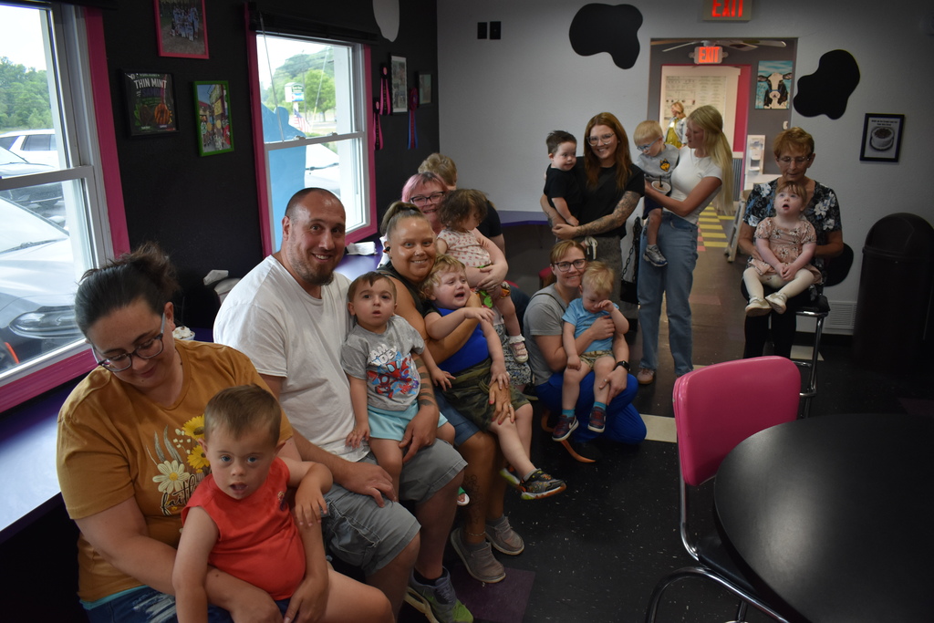 Families and children at Spotted Cow posing for group photo