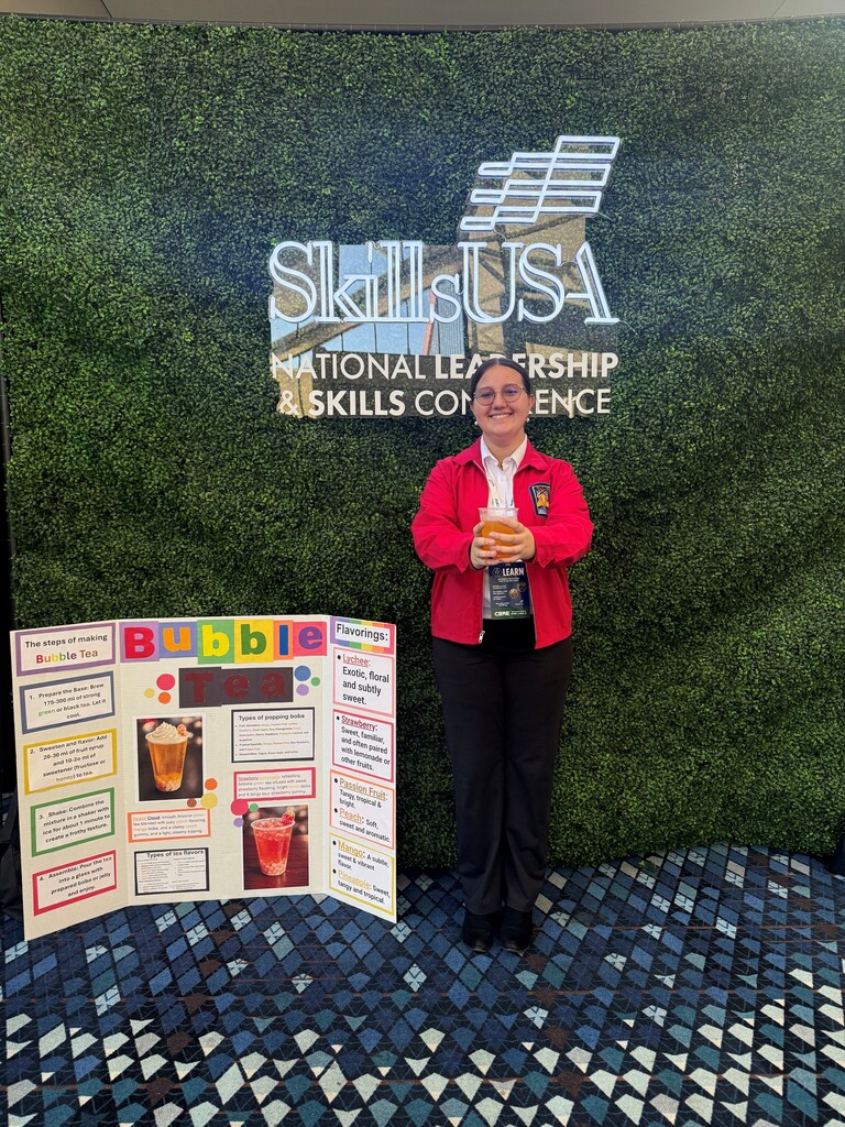 A student posing with her bubble tea at the competition