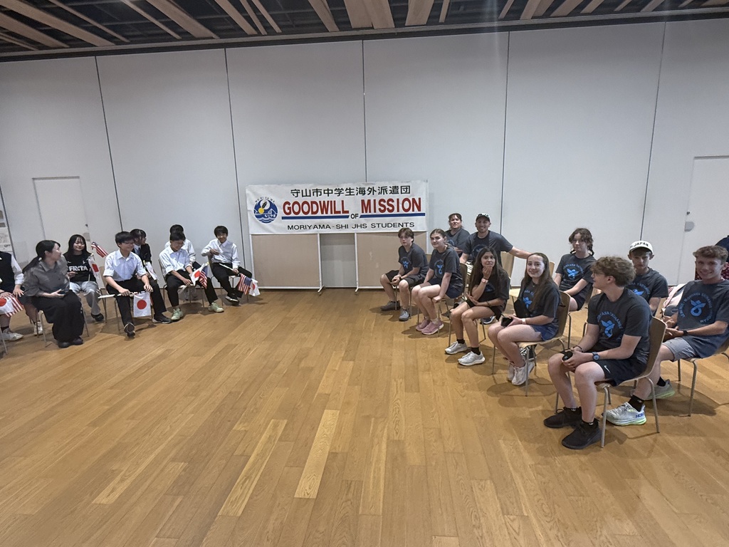 The Japanese and American students sitting in a room together