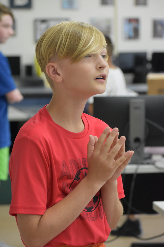 A student reading a screen looking away from the camera