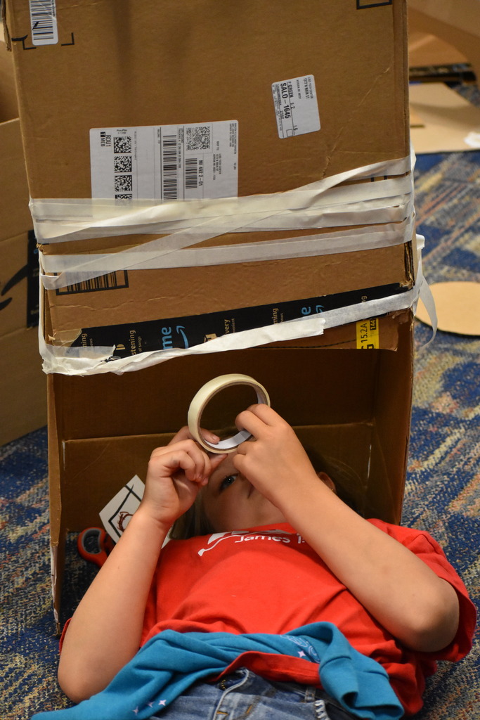 A student working on a box construction project