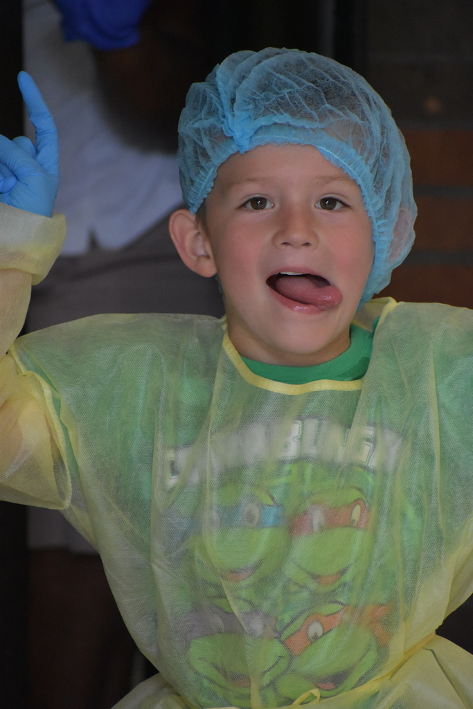 A kid making a silly face at the camera