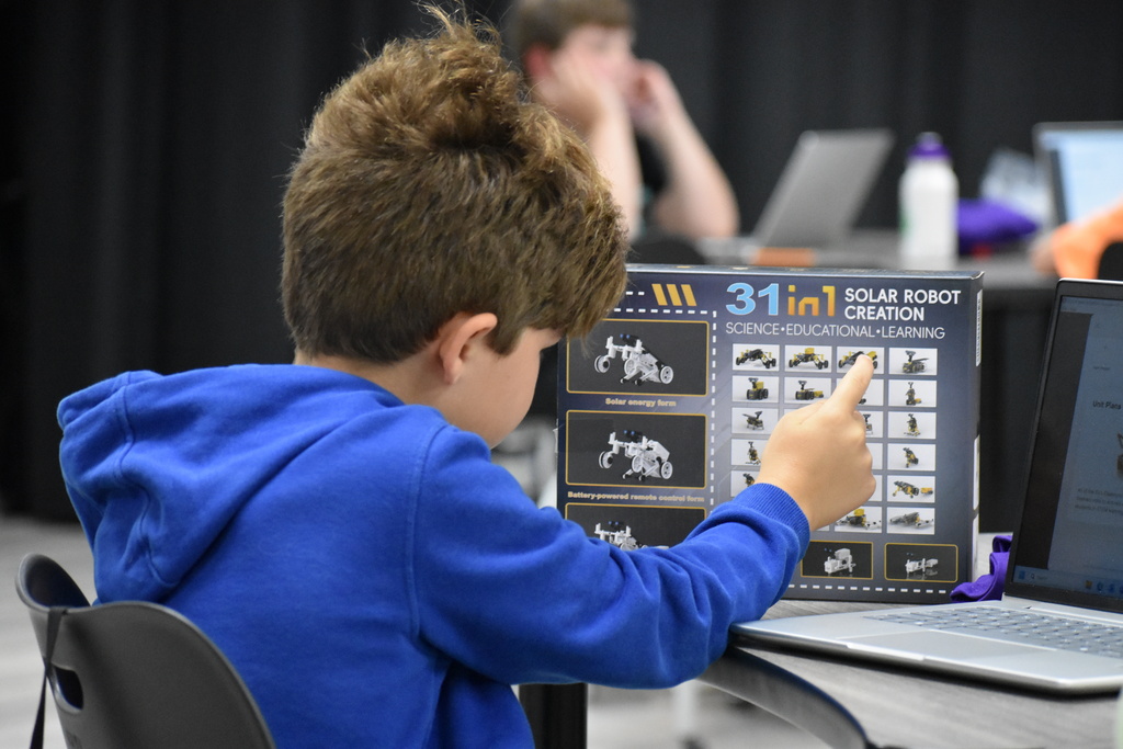 A kid making choices for a robot
