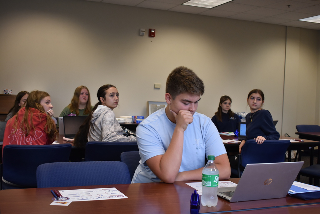 Students at their seats with computers