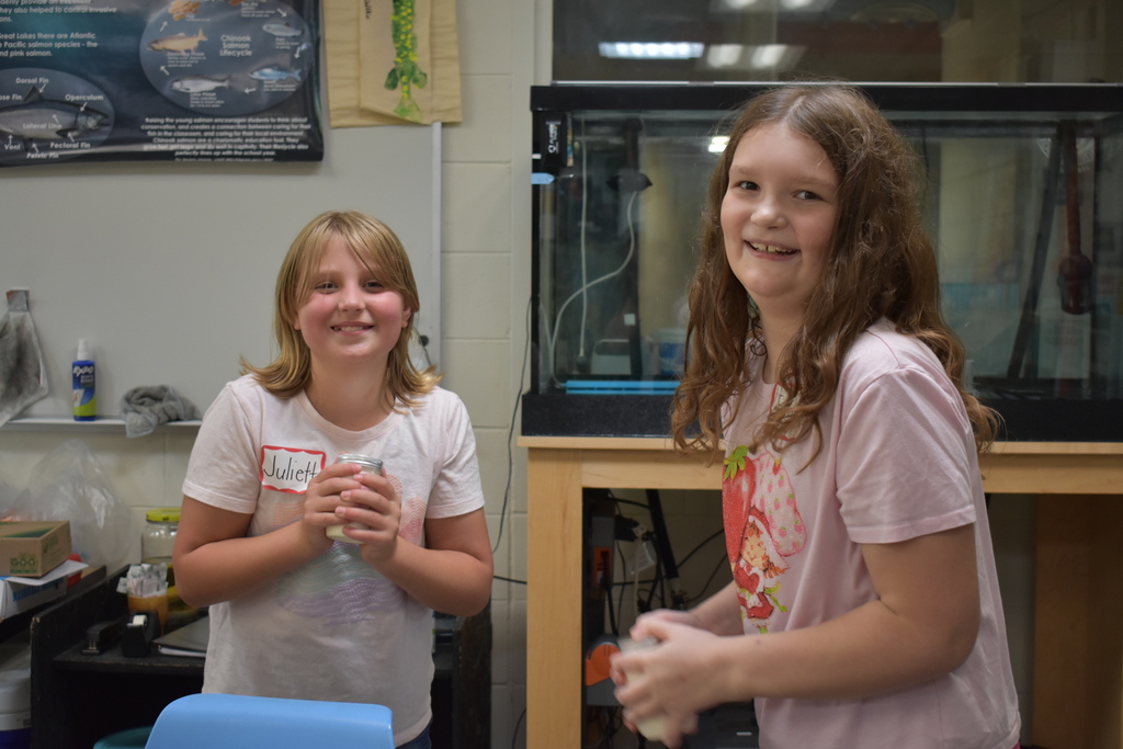 Two students shaking their butter