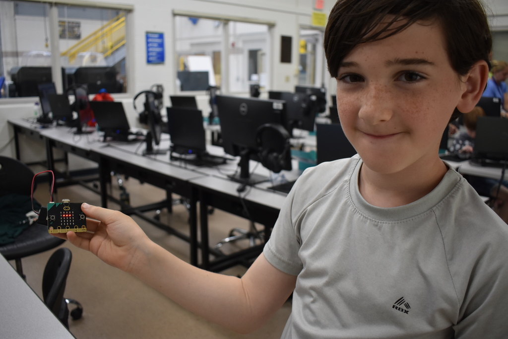 A student showing us his robot