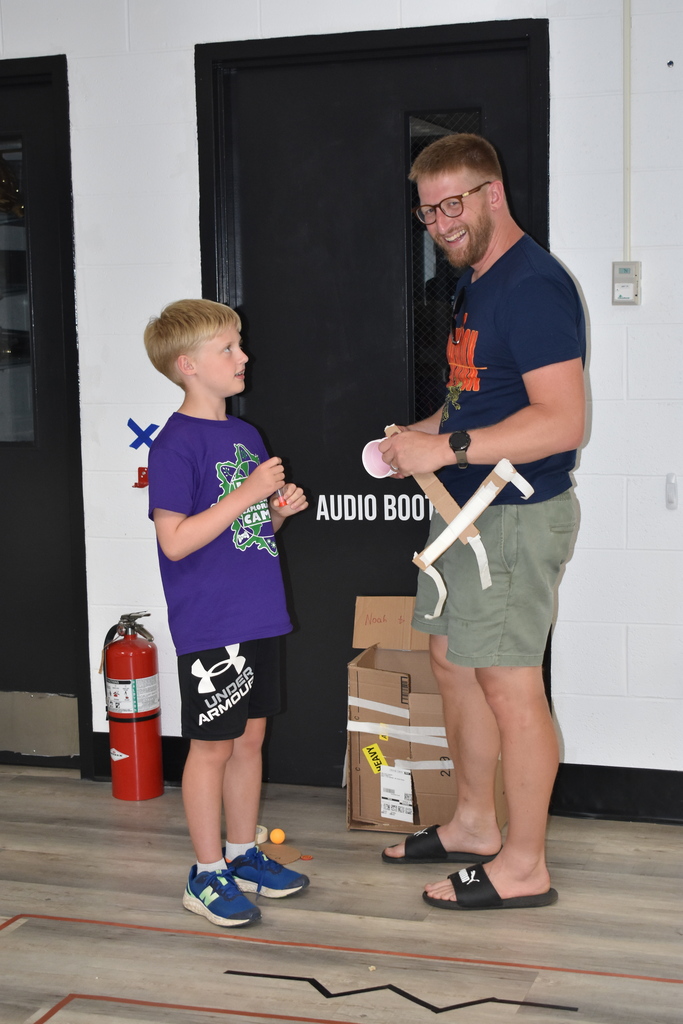 A student showing his family member his game