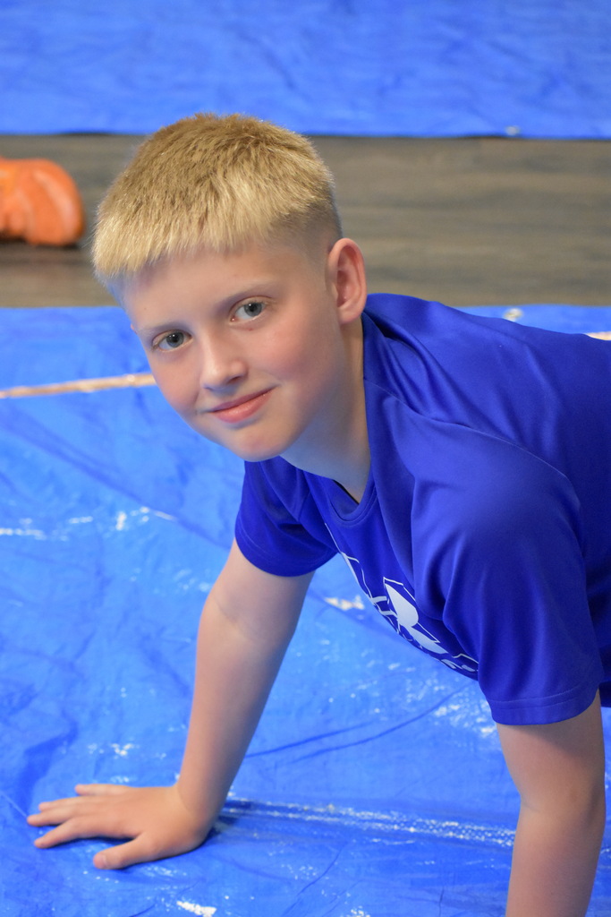 A student looking at the camera and smiling 