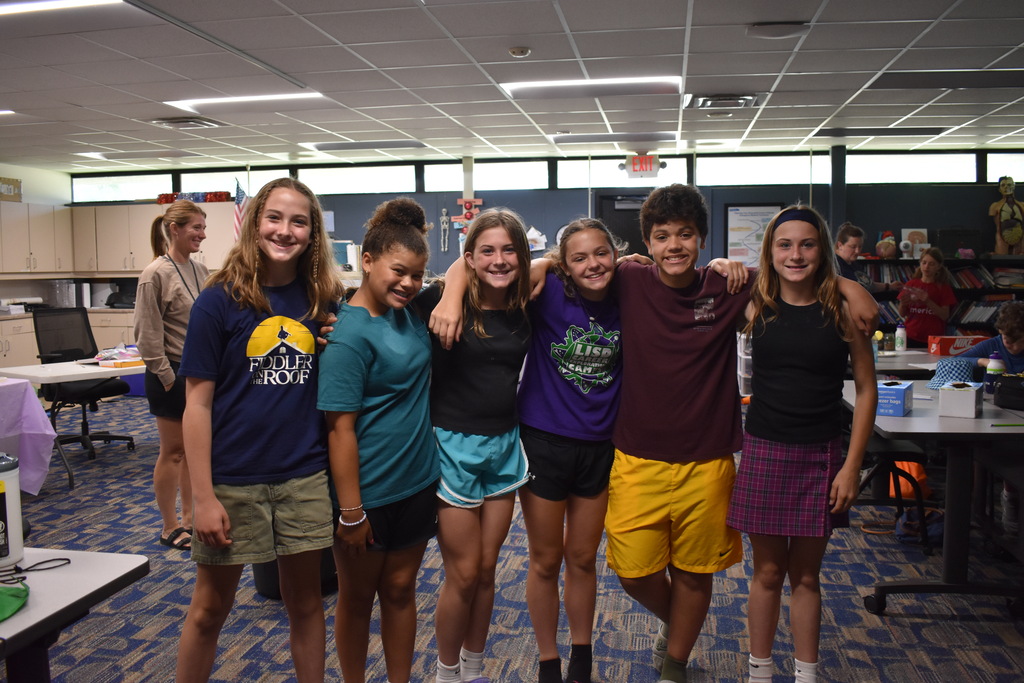 Students smiling at the camera