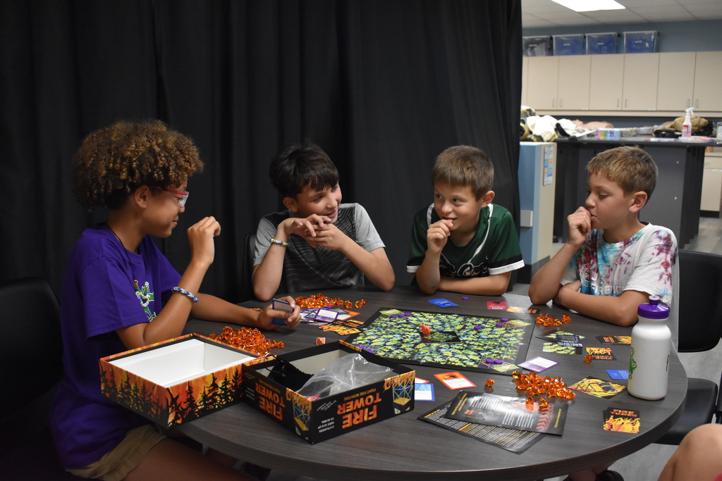 Four students playing a game