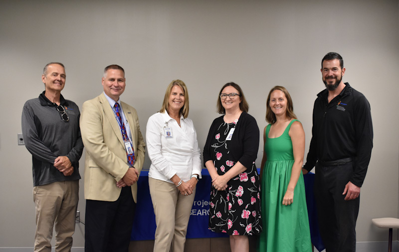 LISD staff members posing for a photo at the event