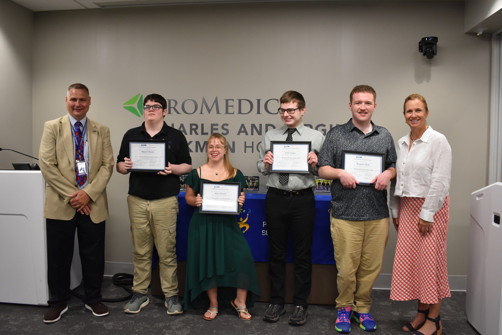 The four graduates with the president of the hospital and the superintendent