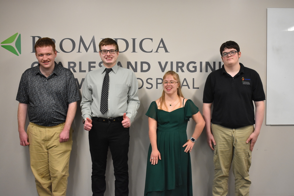 The four students who completed the program posing for a photo
