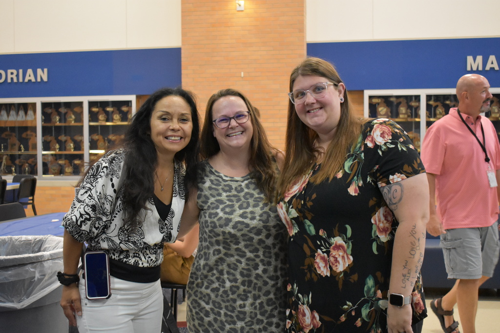 Three team members from transportation smile at the camera