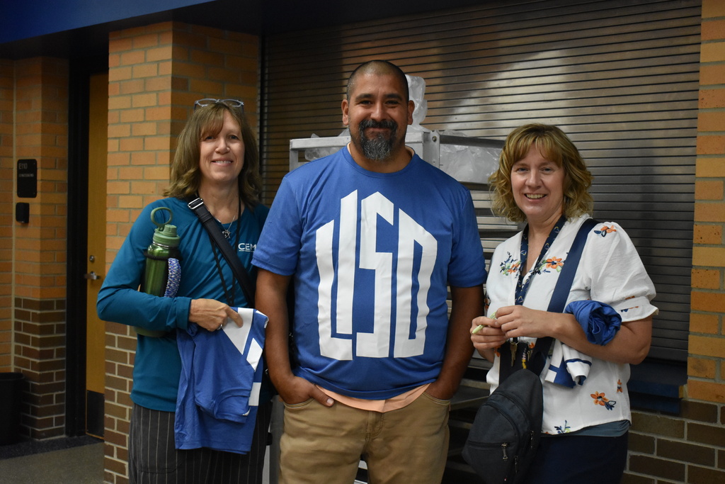 Three LISD team members stop for a photo together 