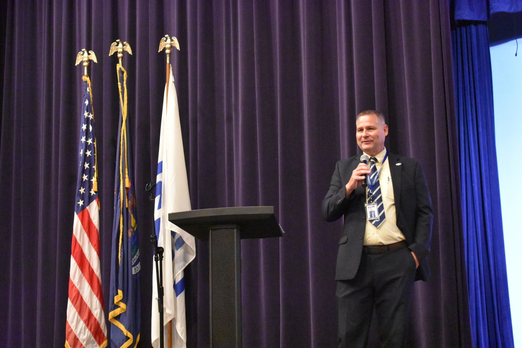 Superintendent Mark Haag presents from the stage