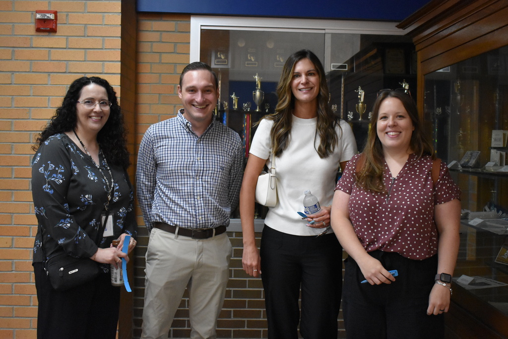 Four of our finance department team members stop for a photo