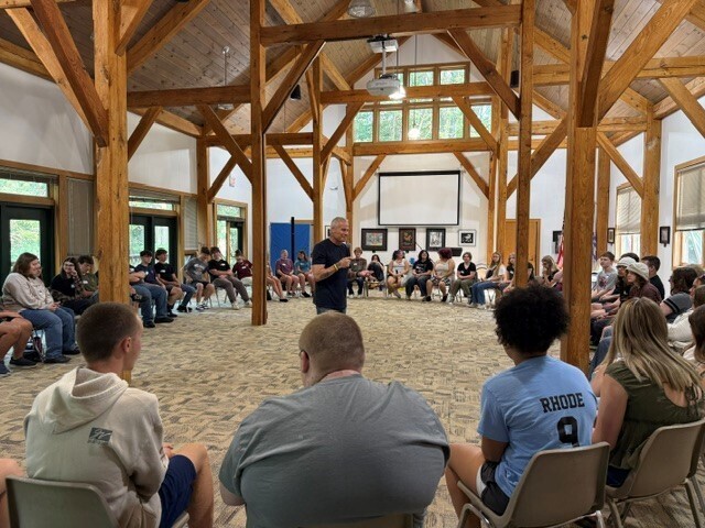 JC LISD Academy students sitting in chairs in a large circle and a presenter is speaking to them from the middle of the circle