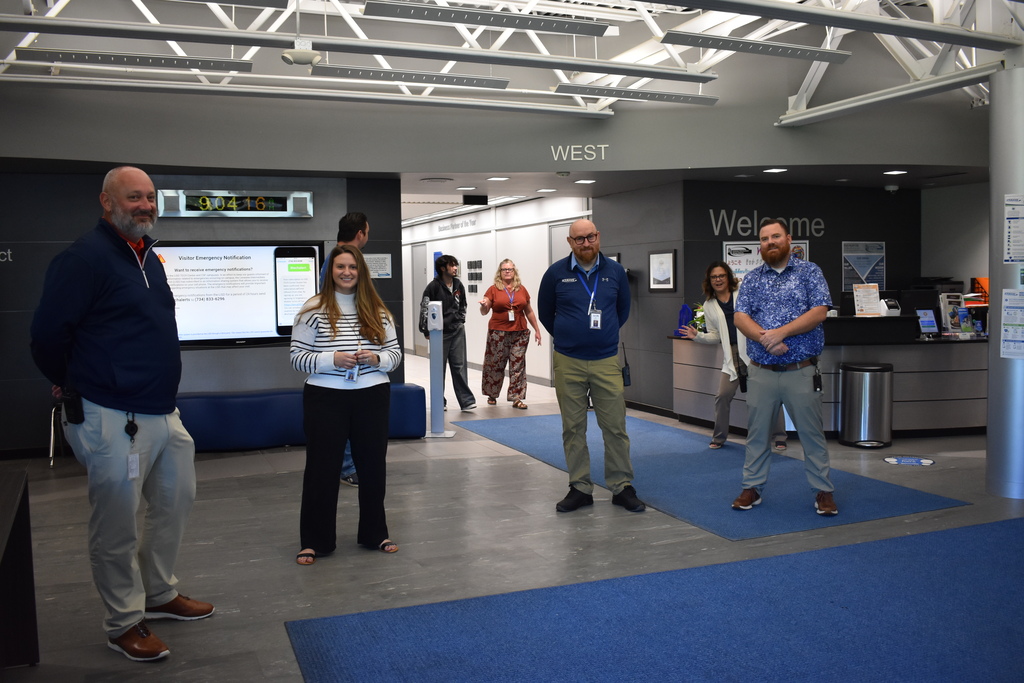 Staff at the TECH Center standing in the lobby to welcome students