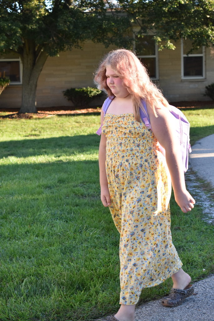 A student walking into the building