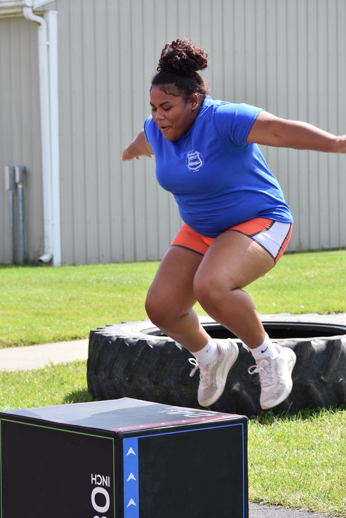 A student completing a box jump 