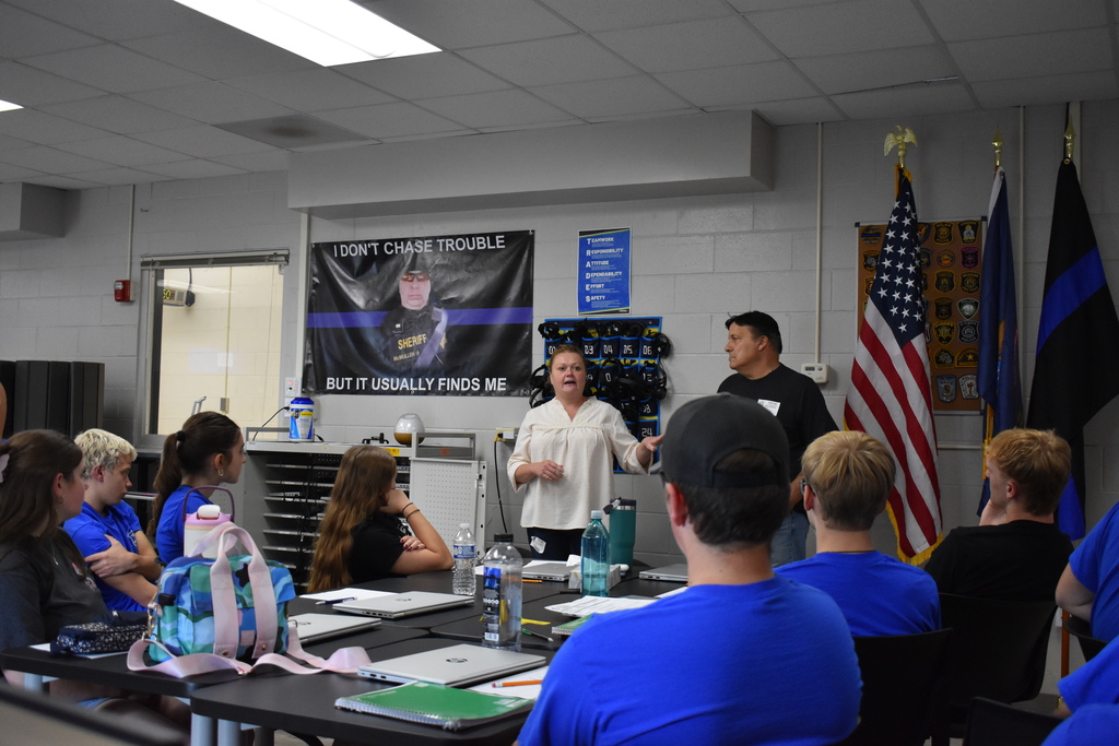 Students seated in a classroom setting while Holly and Mario DiPippo speak to them about their experience in New York City on September 11, 2001.