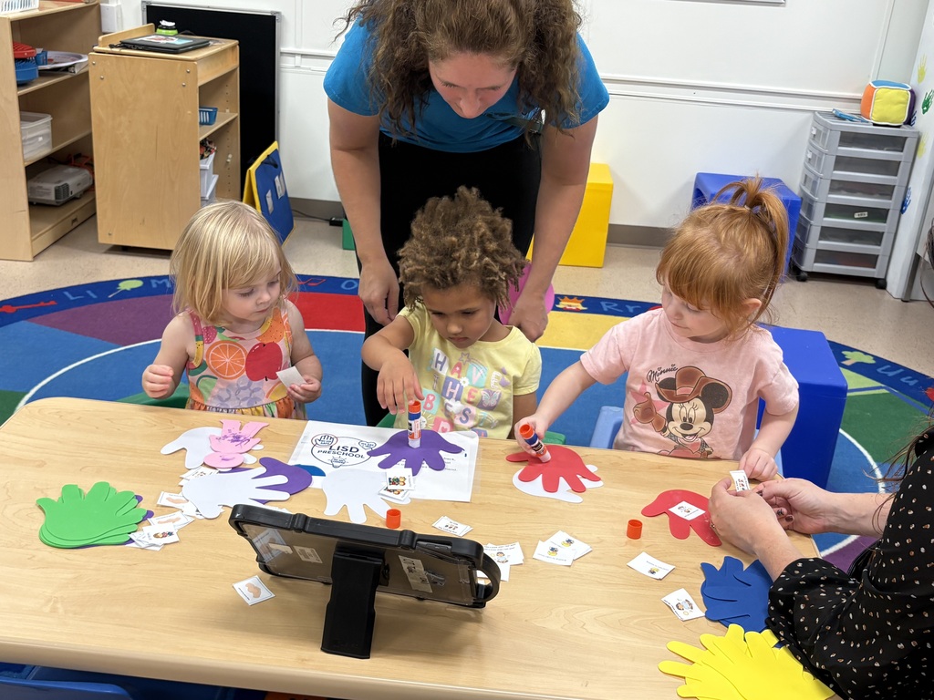 Children working on making take home project for being safe.