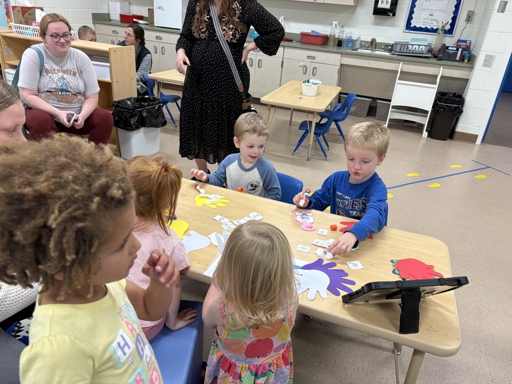 Children at a table with art project about being safe.