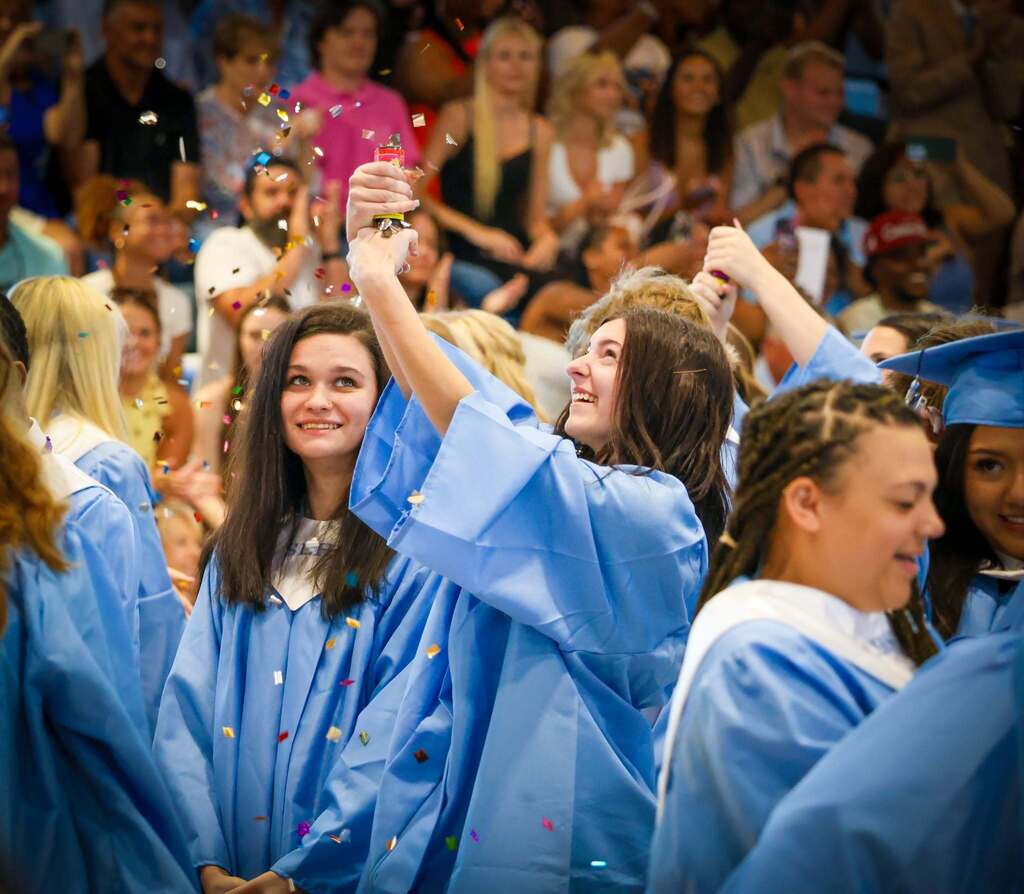 SLHS Graduates celebrate by popping a confetti cannon