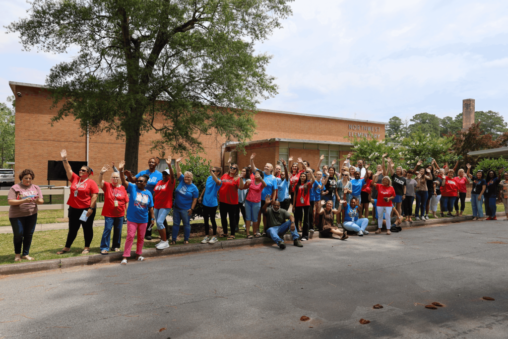 Teachers and staff wave goodbye for the summer.