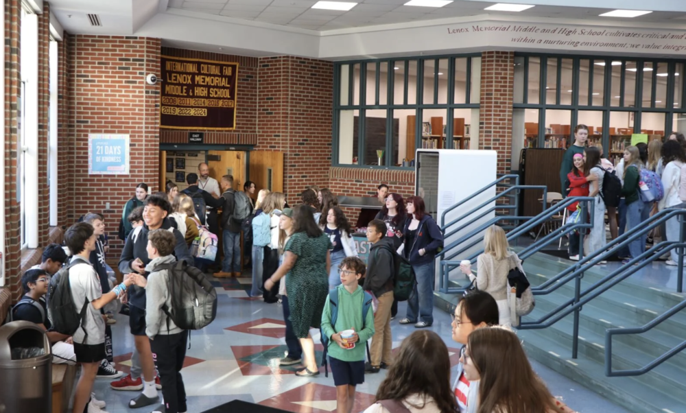 Students gather in the lobby of Lenox Memorial Middle and High School on the first day of school last August. The superintendent is sending out a survey to the school community about whether it should continue to use "Millionaires" as its athletics moniker.
