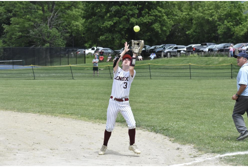 Lenox second baseman Lilly MacDonald goes over to the first base line to grab a fly ball, the final out of the game that gave Lenox the win over Hoosac Valley in the state tournament. 