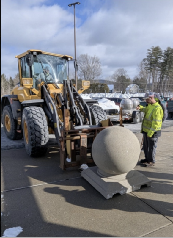 Lenox DPW installing bollard