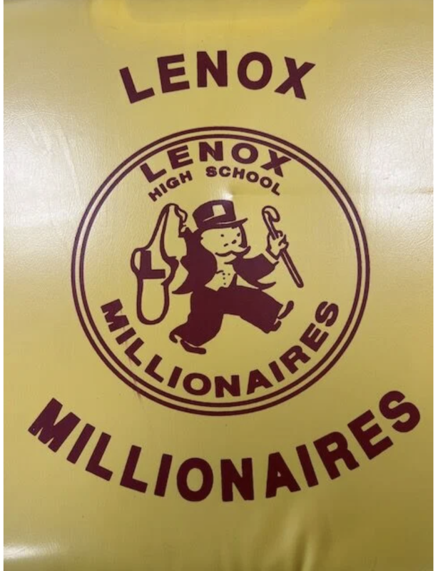 The LMMHS athletics mascot is displayed on a seat cushion inside a trophy case at the middle and high school. 