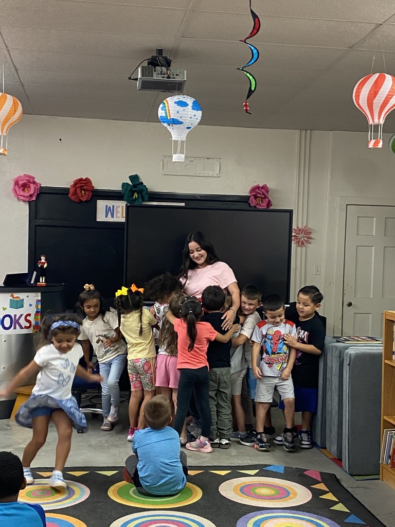 Book club reading to kindergarten. 