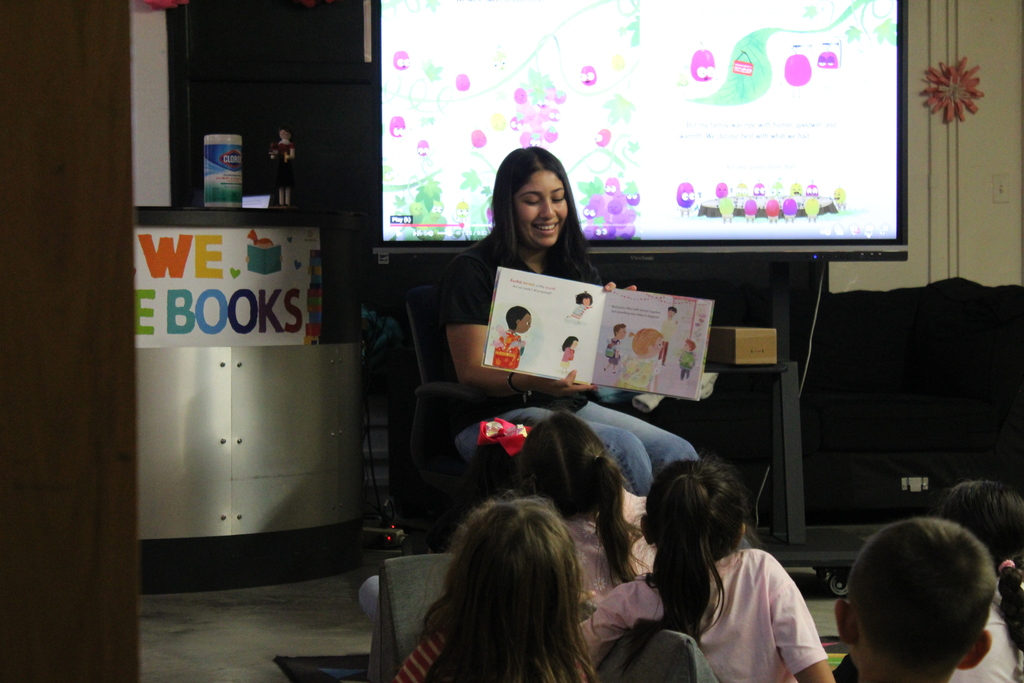 Book club reading to kindergarten. 