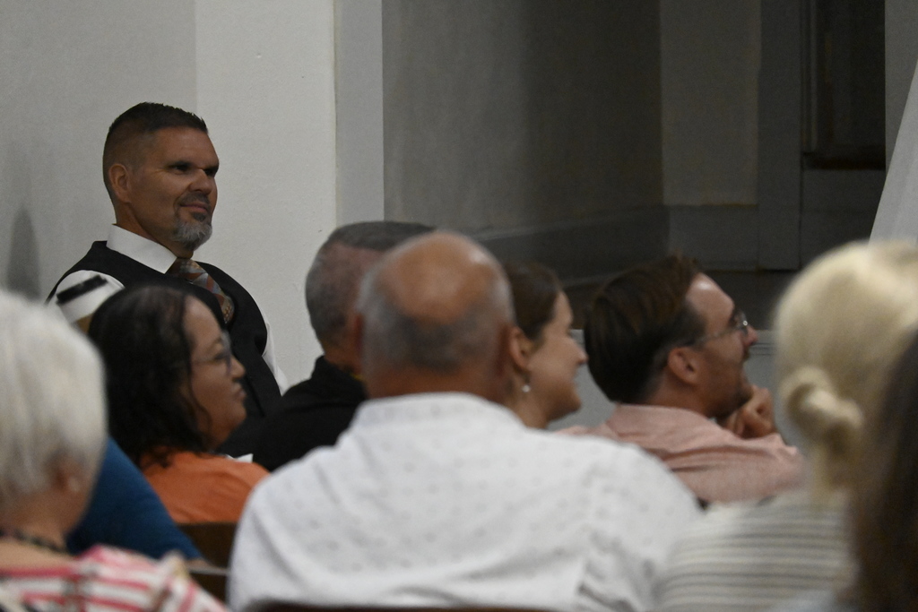 Mr. Everett listening to the presentation. 
