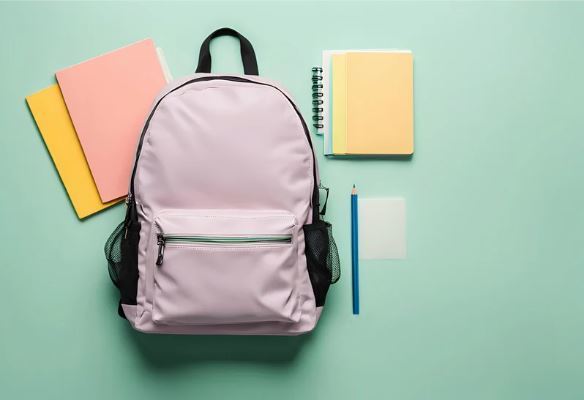 Picture of a backpack, notebook, pencil, and folders