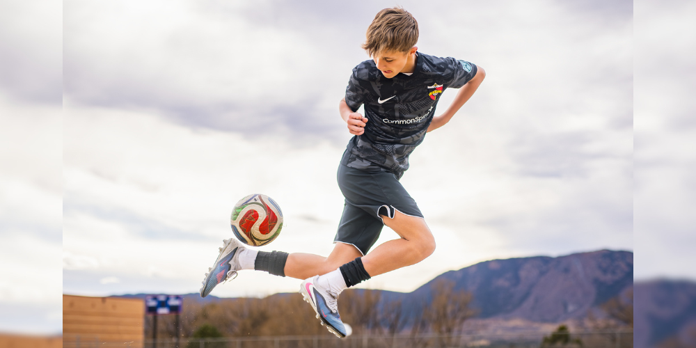Max jumping and juggling a soccer ball