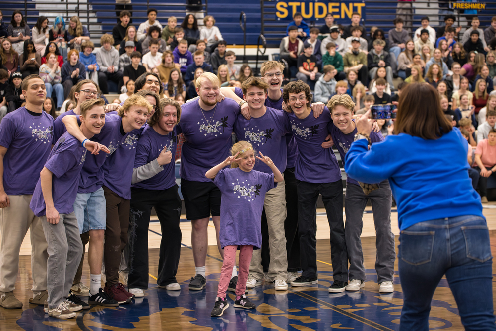 Brooks poses with the men of PR