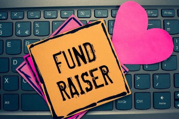 Graphic with the word fundraiser and a heart