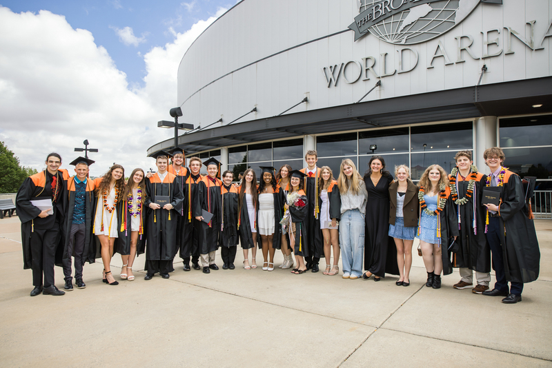 Group of graduates outside venue.
