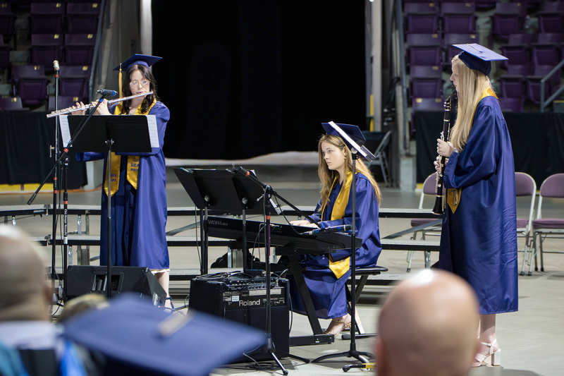 A trio playing Rainbow Connection