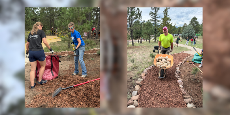 LPES staff members shoveling mulch and carrying rocks in a wheelbarrow