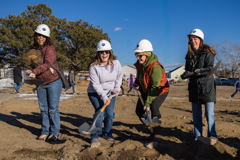 HSEA Parents from the Husky Pack ceremoniously dig dirt 
