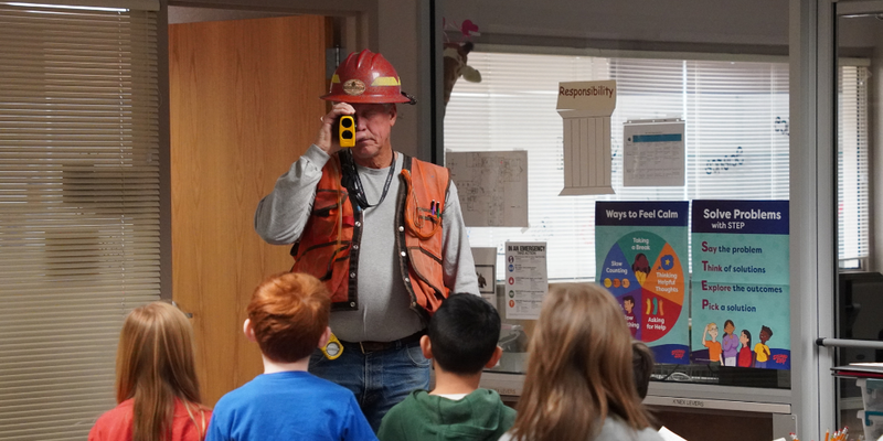 A professional forester from the Colorado State Forest Service speaks to students
