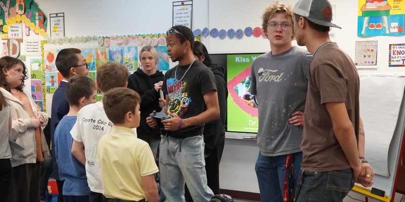 Construction and welding students speak to Kilmer Elementary students