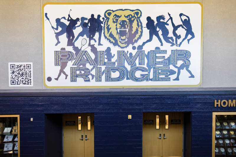 Palmer Ridge mural above trophy case by gym