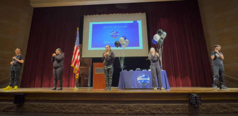 Students performing sign language.